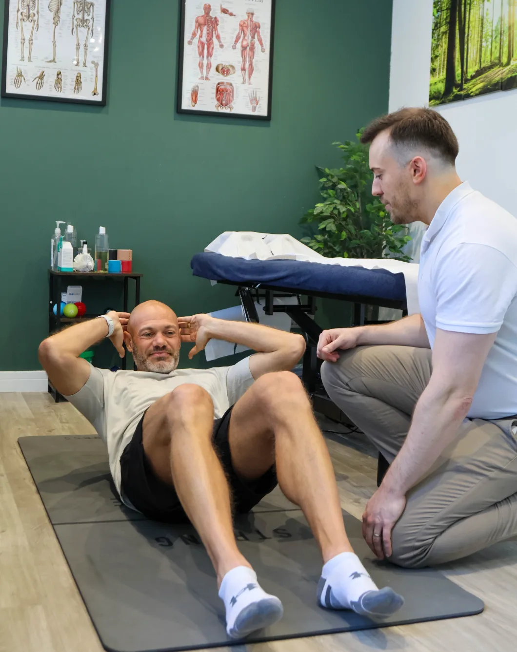 Supervised exercise rehabilitation session on the mat